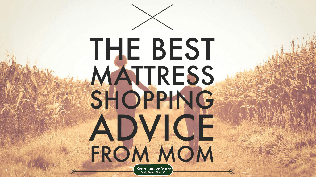 Mom & daughter walking together in field of wheat discussing mattress shopping advice